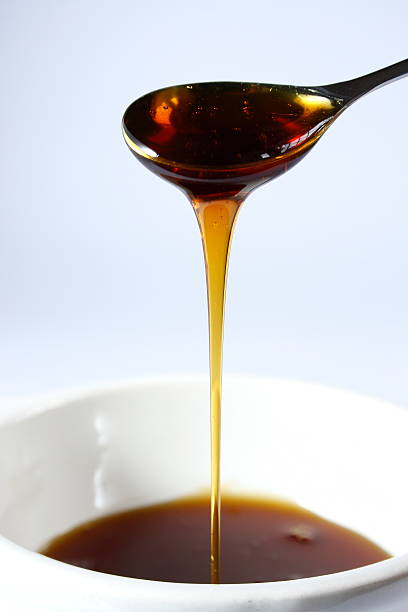 Bowl of syrup stock photo