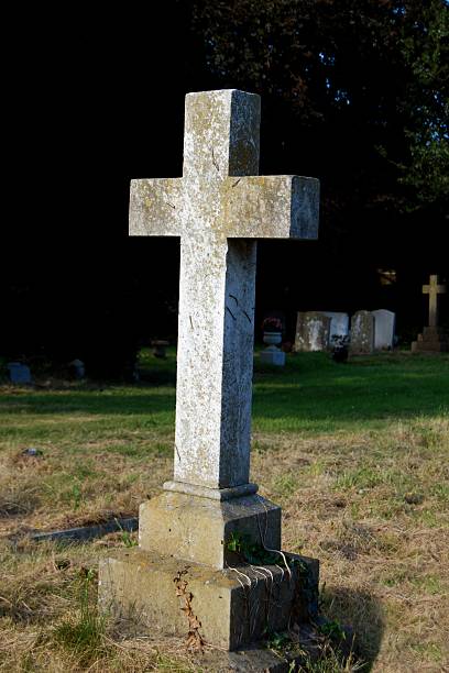 istock Crucifix gravestone in cemetery 105946958