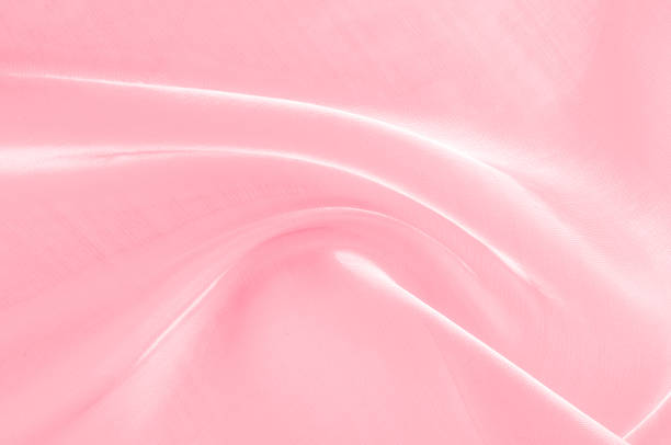 istock Background texture, pattern. Cloth pink silk. Smooth elegant pink silk or satin can use as wedding background. Luxurious valentine day background design. 1059482198