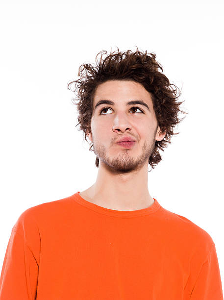 istock pensive puckering young man portrait 105948860