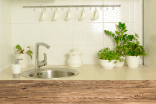 istock Wooden table top on blur interior background 1059491716