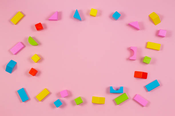istock Colorful wooden building blocks on pink background 1059500032