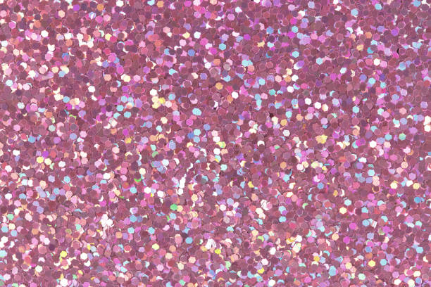 istock Pink glitter texture on macro. Low contrast photo. 1059501834