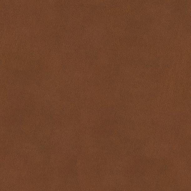 istock Natural qualitative brown leather texture on macro. Seamless square background. 1059503352