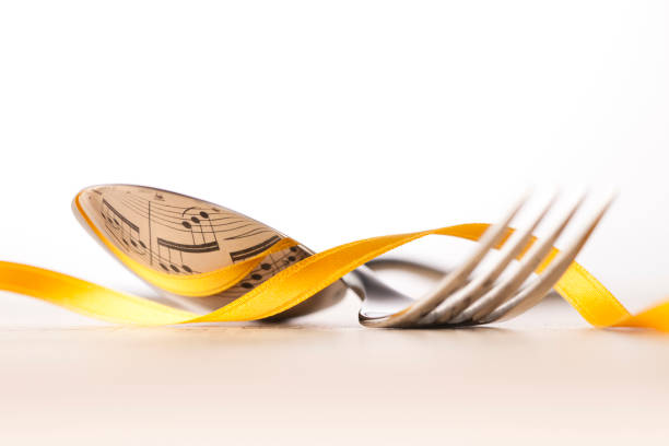 istock Music and cook. Musical score reflected into cutlery. 1059507628