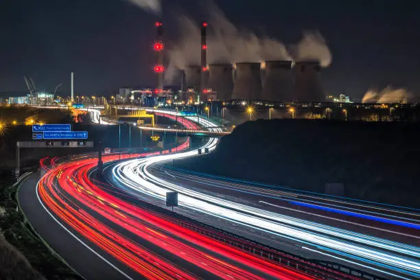 A long exposure shot of traffic passing Ferrybridge power station in West Yorkshire