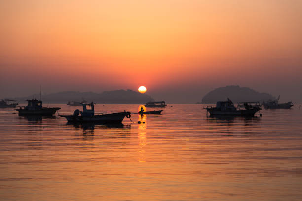 istock Vd737 Sunrise at a small harbor 1059510600