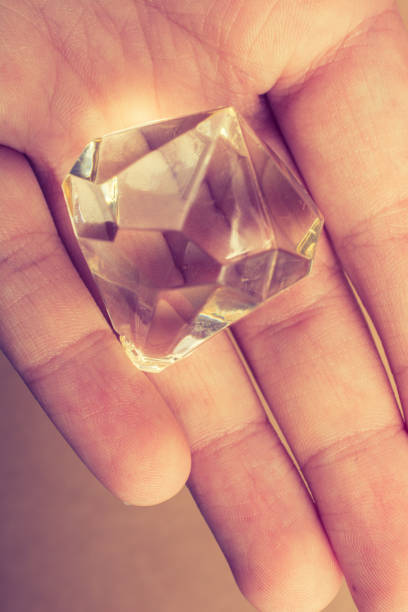 istock Fake diamond stone in hand 1059512798