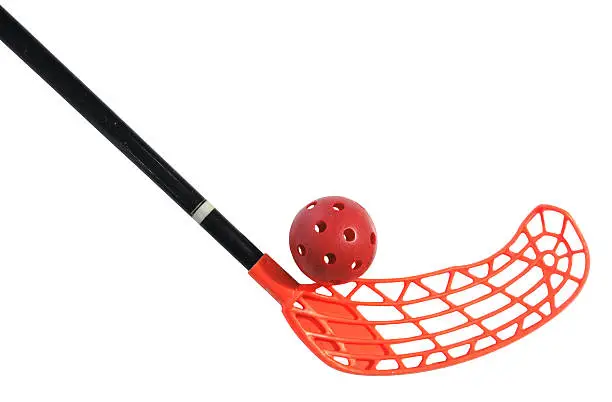 old floorball stick and ball on the white background