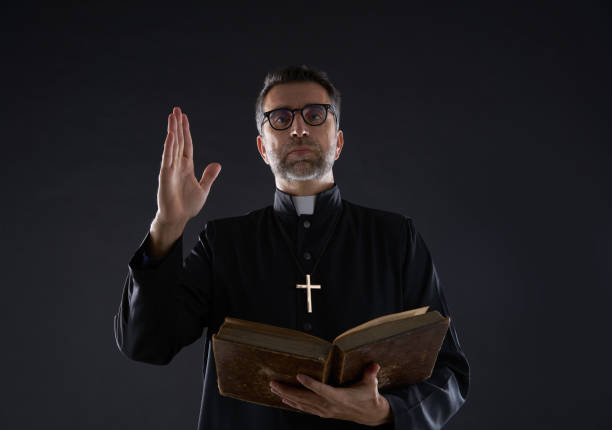 istock Priest male blessing hand with holy Bible 1059515846