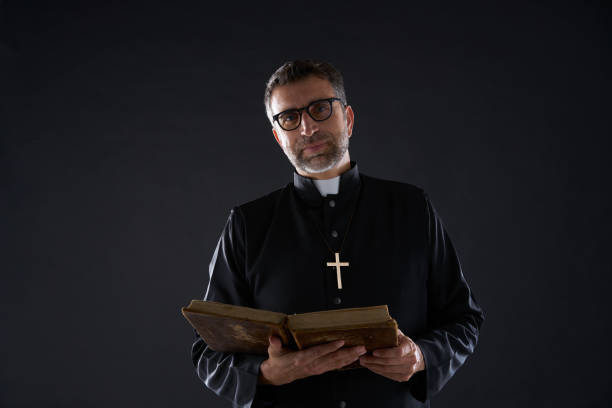 istock Priest portrait with Holy Bible in hands 1059516154