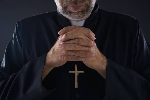 istock Praying hands priest portrait of pastor 1059517320