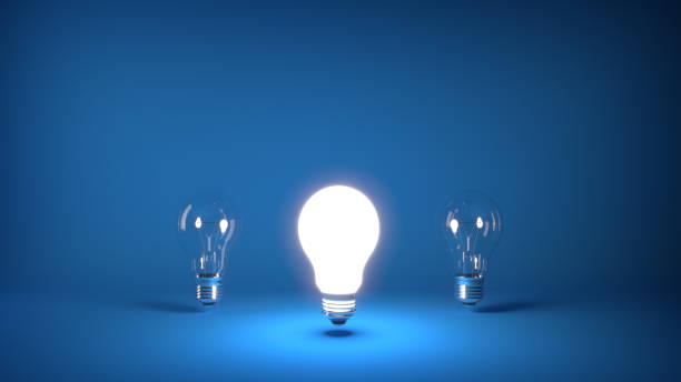 istock Light bulb turned on in the foreground with two light bulbs turned off in the background 1059519650