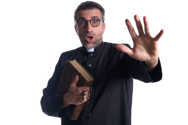 istock Priest scared shounting raising hand 1059521540
