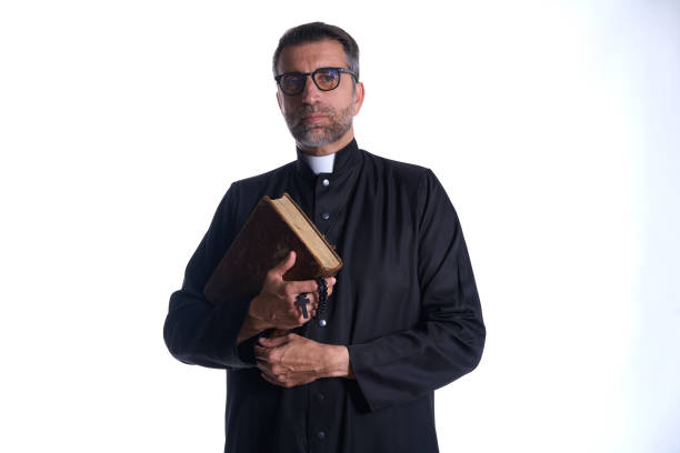 istock Priest portrait with Holy Bible in hands 1059522118