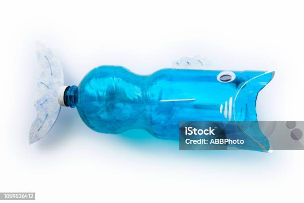 Plastic Bottle Recycled In A Fish Figure Reuse Garbabe Stock Photo - Download Image Now