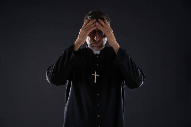 istock Priest male hands in head worried 1059526972
