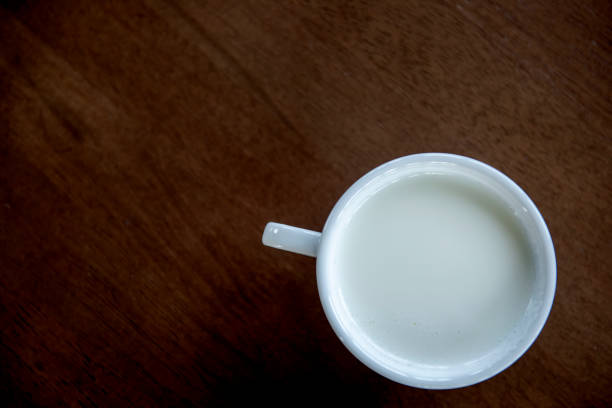 istock A white cup of milk on wooden 1059533582