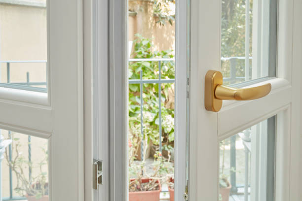 istock New, white double glazed window with golden, frosted handle 1059536362