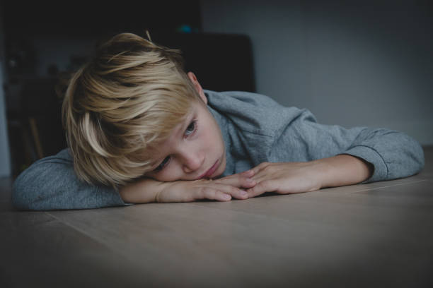 istock sad stressed tired exhausted child at home 1059536468