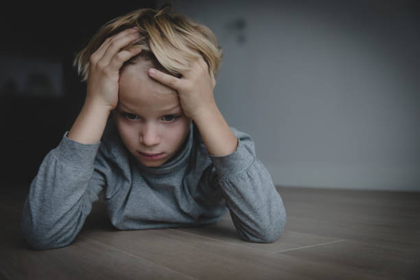 istock sad stressed tired exhausted child at home 1059537830