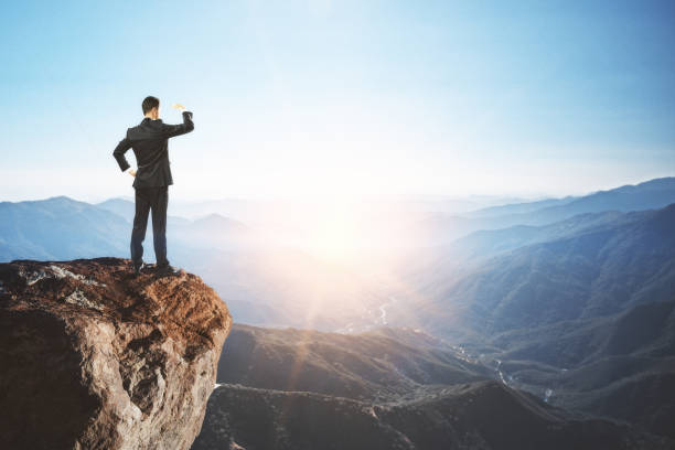 istock businessman at dawn background 1059548130