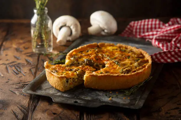 Homemade mushroom pie with cheese and herbs