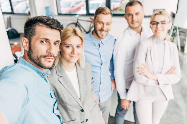 istock confident young start up team smiling at camera in office 1059551662