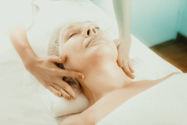 istock Mature woman having face massage 1059552176