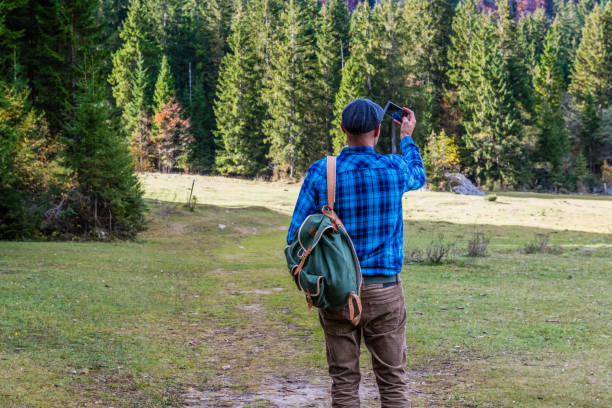 istock Young Adult Man taking selfie in the Forest 1059552648