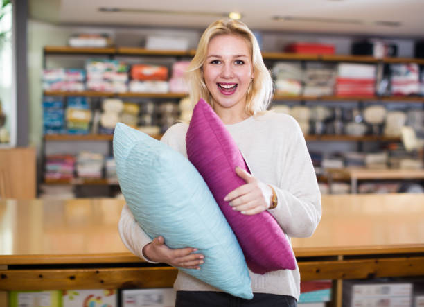 istock Happy girl enjoying purchased pillows 1059552850