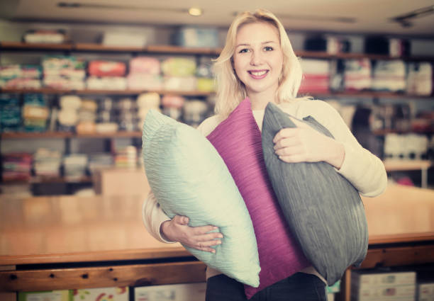 istock Young girl enjoying purchased pillows 1059552856