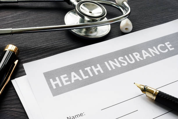 istock Health insurance policy, stethoscope and pen. 1059553008