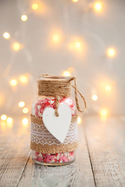 istock sugar candy hearts in a decoration bottle on wooden board 1059554508