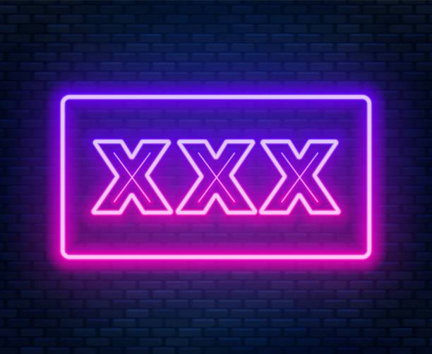 istock XXX neon sign on a dark background. 1059555358