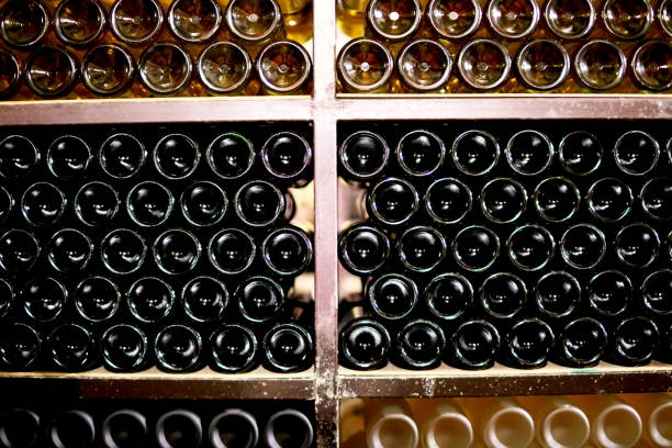 istock Wine bottles in a dark wine cellar 1059564370