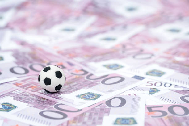 istock soccer ball on money 1059569214