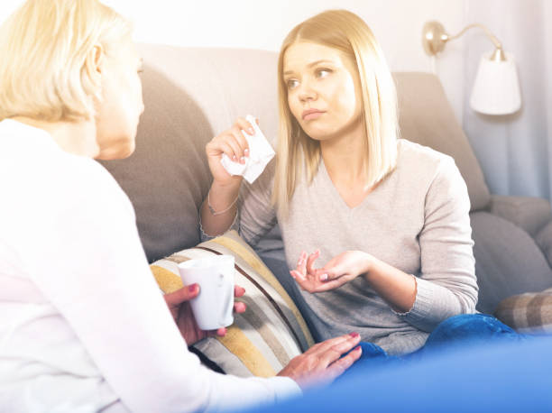 istock woman comforts her adult daughter 1059569898