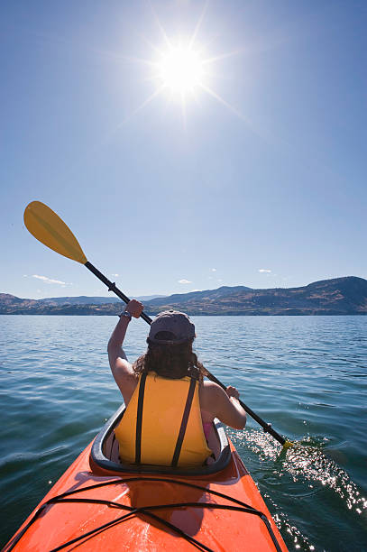 woman sea kayaking - okanagan penticton lake okanagan lake 뉴스 사진 이미지