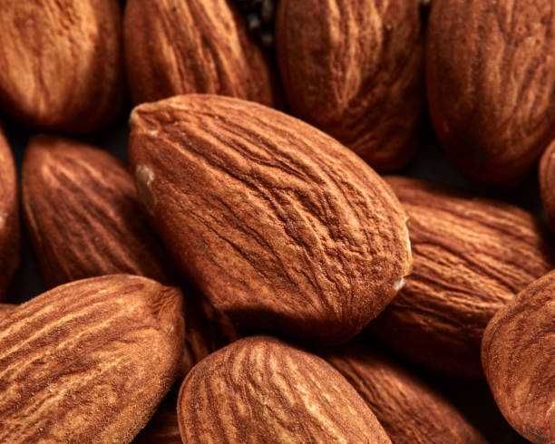 istock Organic texture of almonds. View from above. Almonds macro background. Almond nuts with soft focus. 1059575150