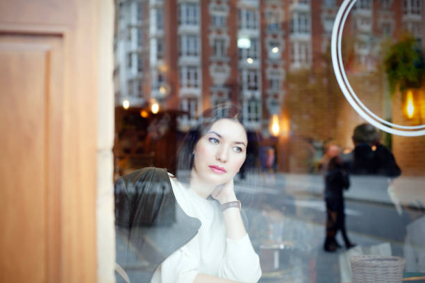 istock Woman sitting in cafe 1059577072