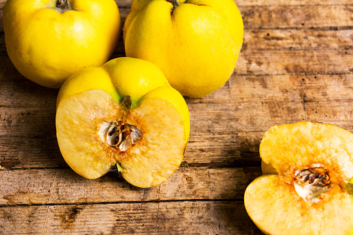 Yellow quince on a rustic wooden table