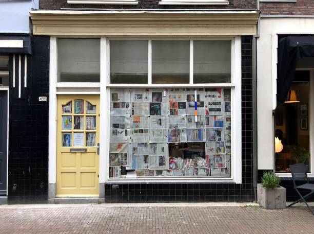 A abandoned store Dordrecht, the Netherlands - October 25, 2018: A abandoned store front with newspaper on de windows in the Dutch city of Dordrecht. dordrecht photos stock pictures, royalty-free photos & images