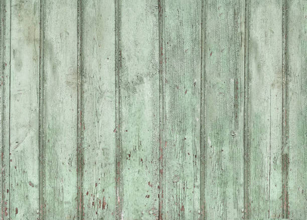 istock Old wooden painted light blue rustic background, paint peeling 1059601552