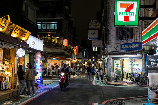 busy streets of yongkang with shops and crowds walking around. Taken at night. Taipei, Taiwan. October 23rd 2018.