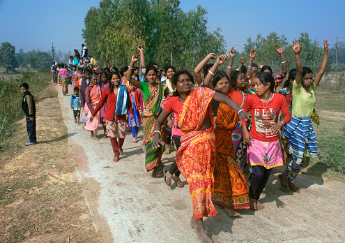 Tusu festival is a tribal festival in rural west bengal. Unmarried girls and women are the main priest of this festival. This festival is very popular in Purulia district of west bengal. Tusu song is the main magical formula or the words recited in prayer to Tusu. \nHere in this picture villagers, mostly women.. celebrate with dance with tribal music on the last day of festival, on the way to immersion.\n\nPhoto taken at a village in Bishnupur, West Bengal, India on 14th Jan 2018.