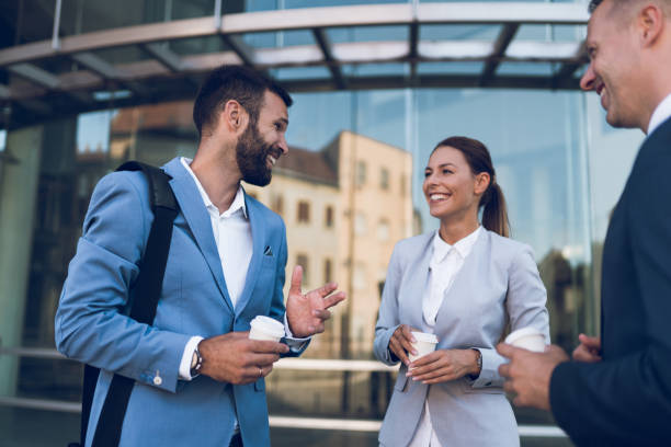 istock Three business colleagues having discussion while standing outdoors 1059612692