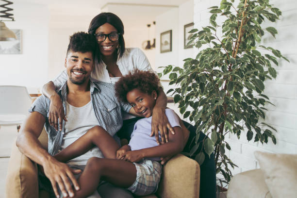 istock Happy parents with daughter at home 1059612876