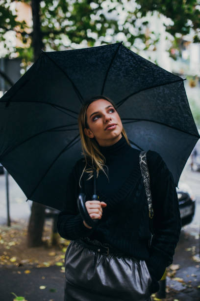 istock Stylish woman with umbrella 1059615828
