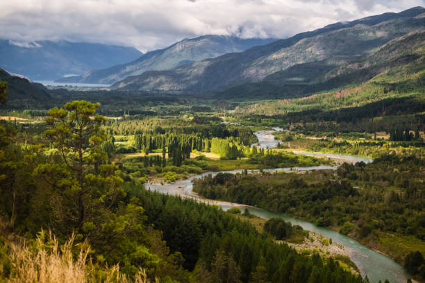 Landscape of Blue river, valley and forest in El Bolson, argentinian Patagonia stock photo
